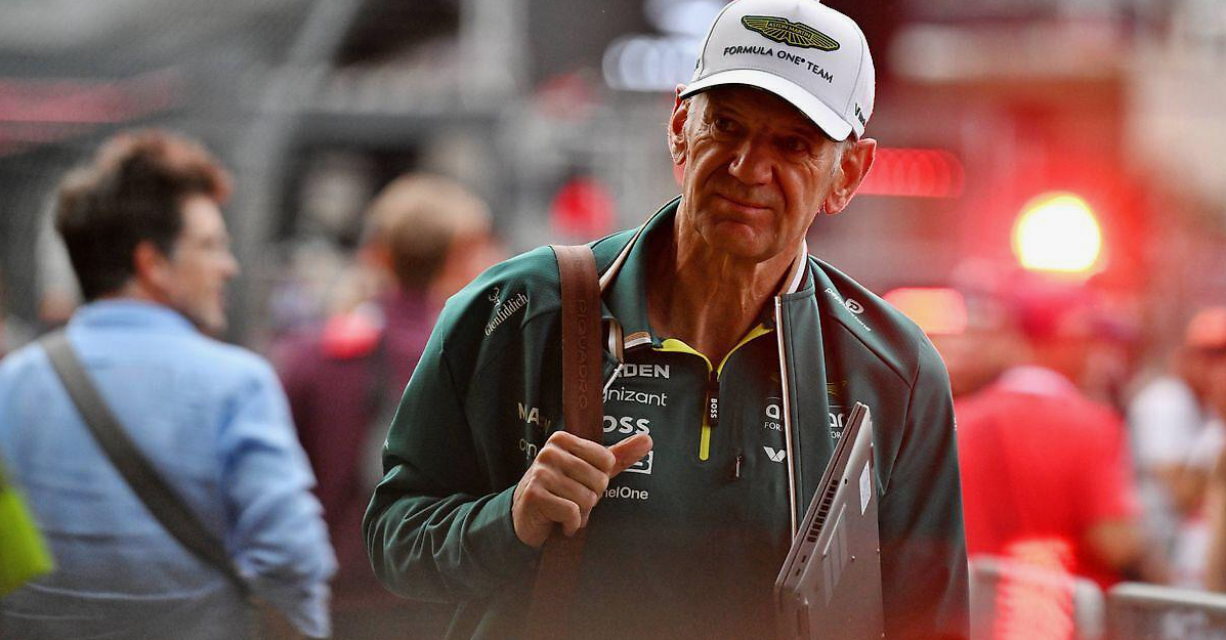 Oversigt over en moderne Formel 1-paddock-garage, der viser avanceret biludvikling og ingeniørudstyr under racerforberedelser