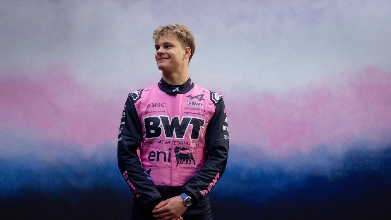 Paul Aron stands in Formula 1 team clothing