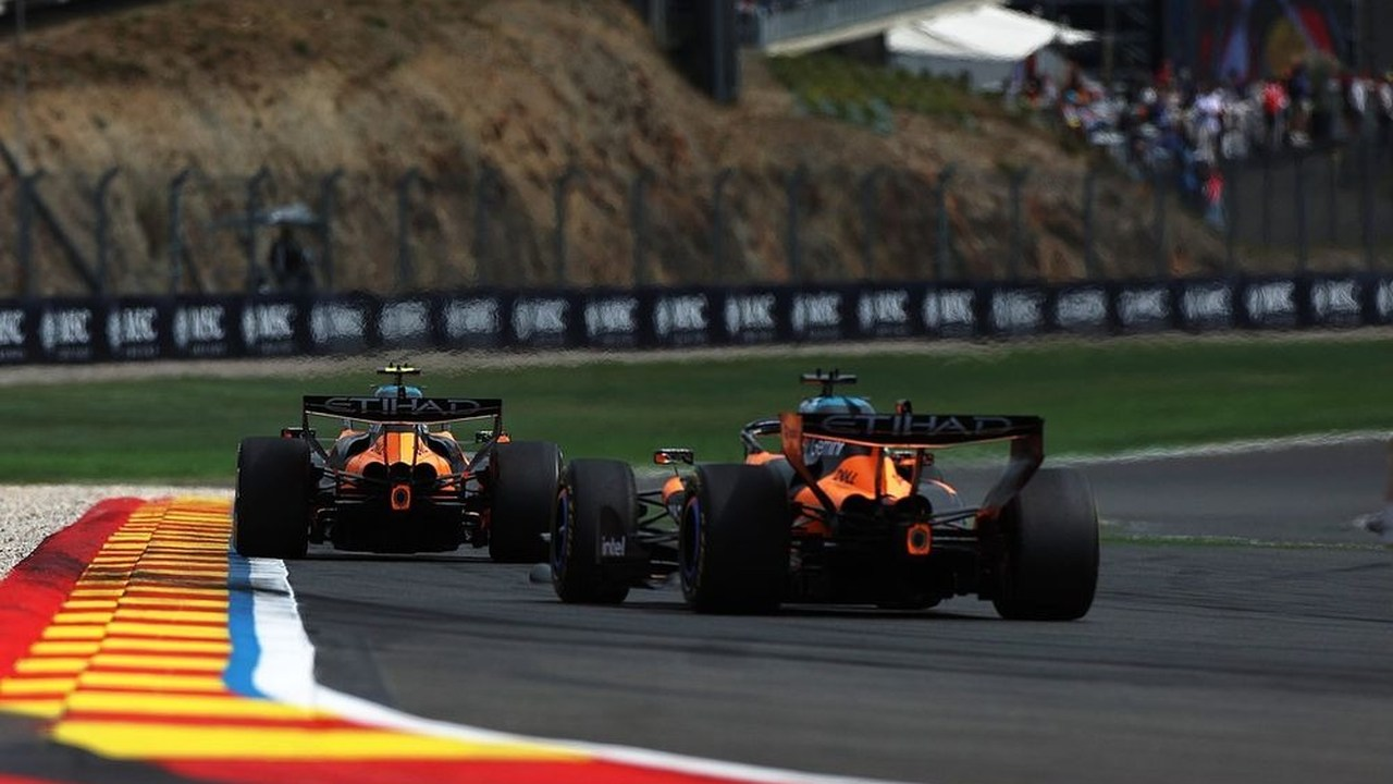 Two McLaren Formula 1 cars run on the circuit