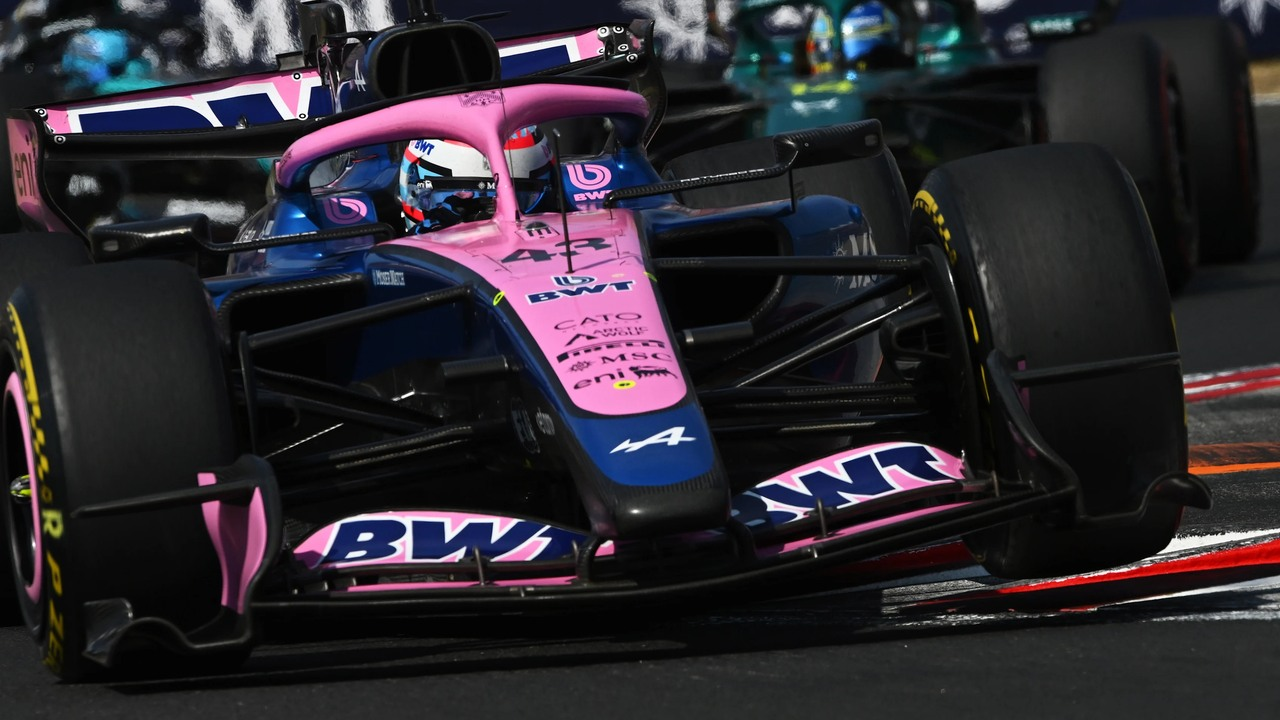 A Formula 1 car drives through a fast corner