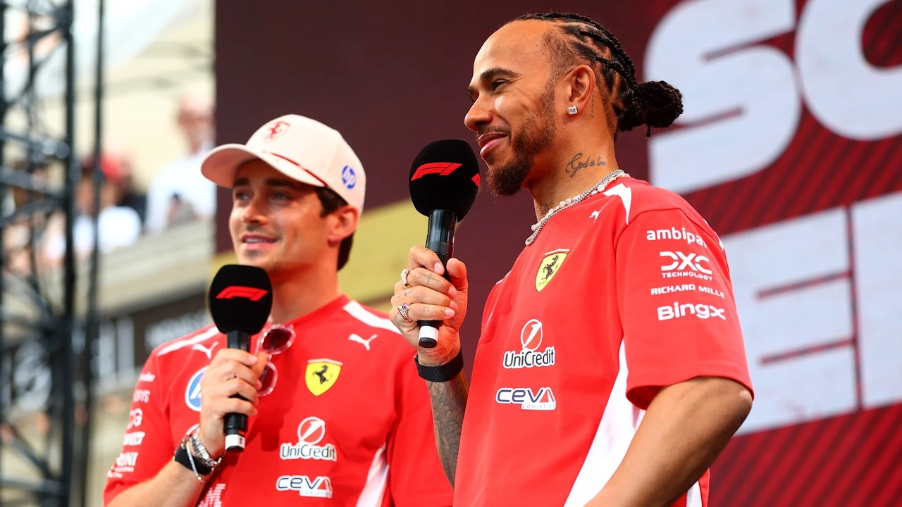 Ferrari Formula 1 team-mates speak together at a circuit